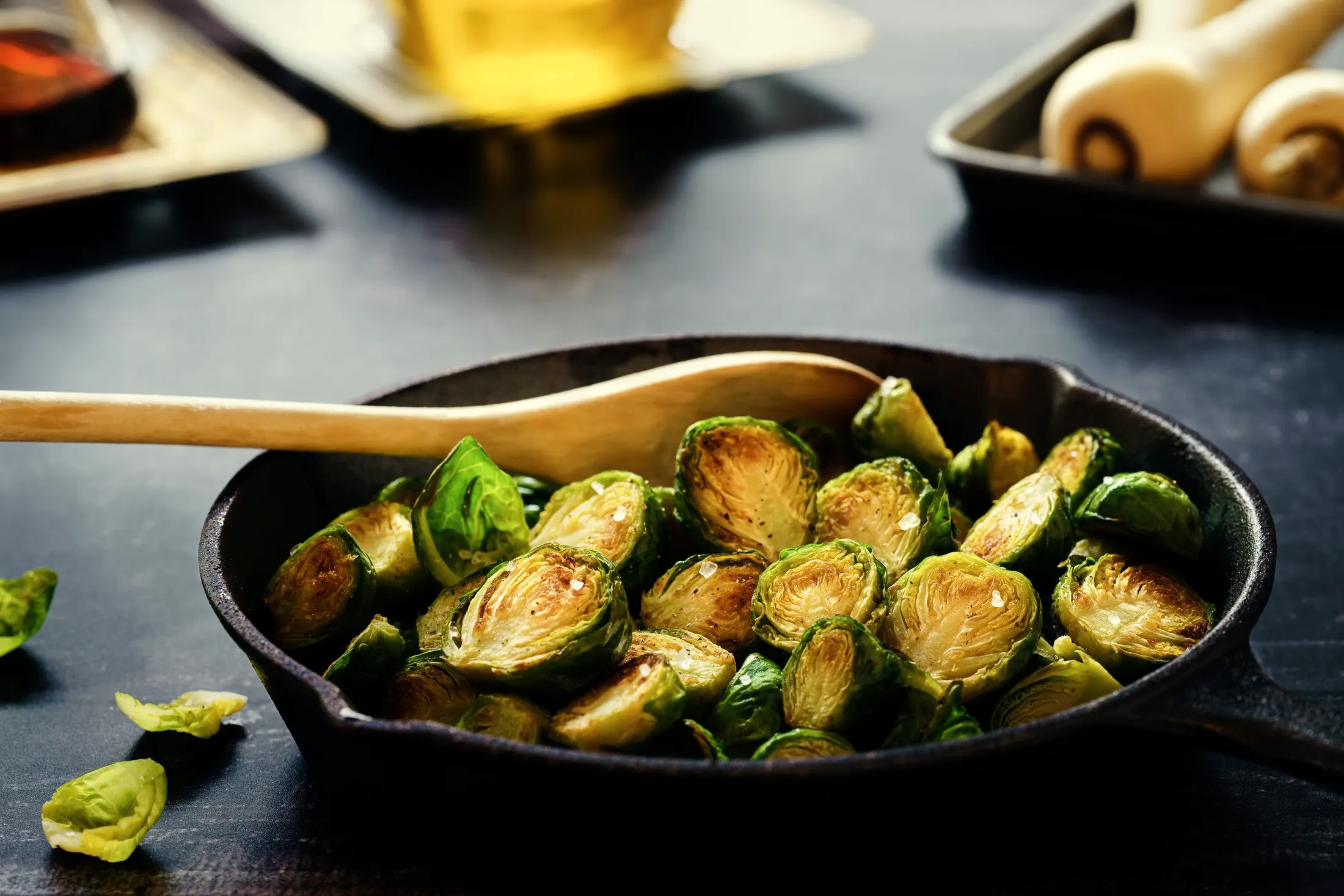 Roasted brussels sprouts with browned edges in a cast iron skillet